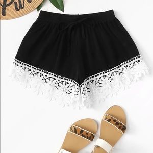 Black drawstring shorts. Never worn.